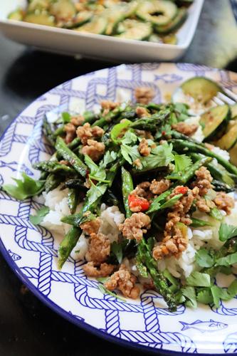 Thin stalks of spring asparagus are blistered, then tossed with ground pork, garlic, ginger and soy sauce.